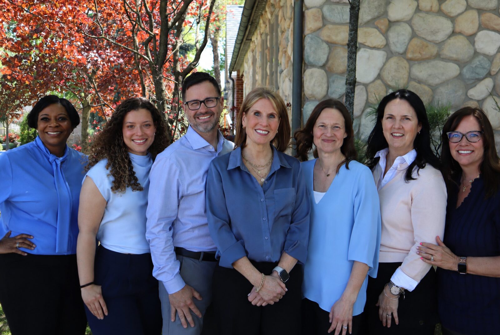 The Hinderliter Hearing Services team — seven team members standing together outside the clinic