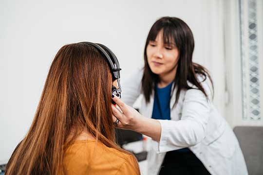 Woman having a professional hearing evaluation